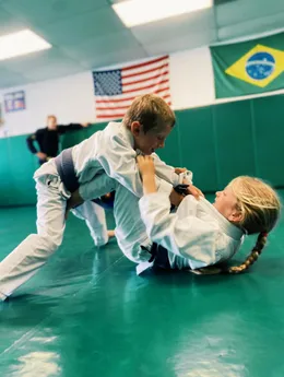 Children training during a kids' Brazilian Jiu-Jitsu class