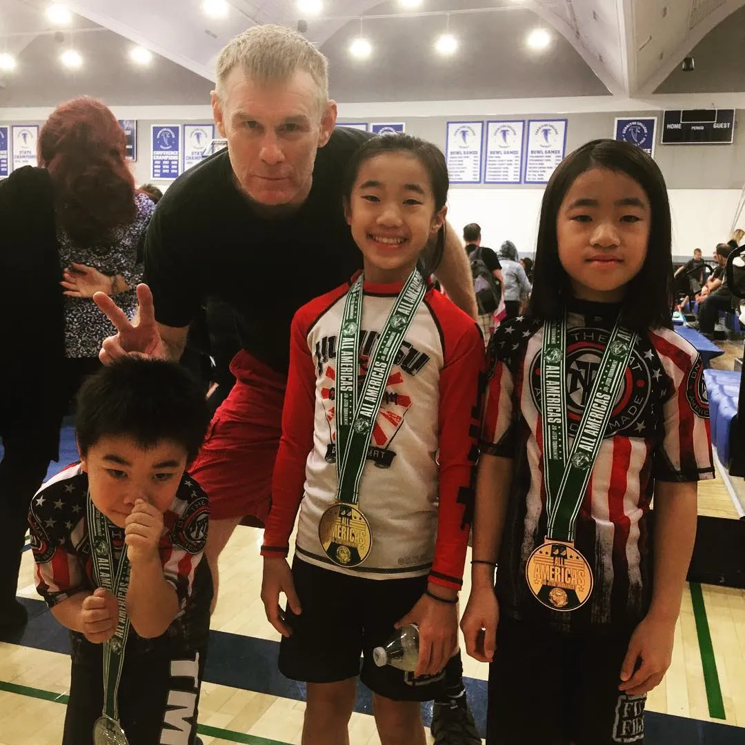 Young Boran students with their medals at a Brazilian Jiu-Jitsu tournament