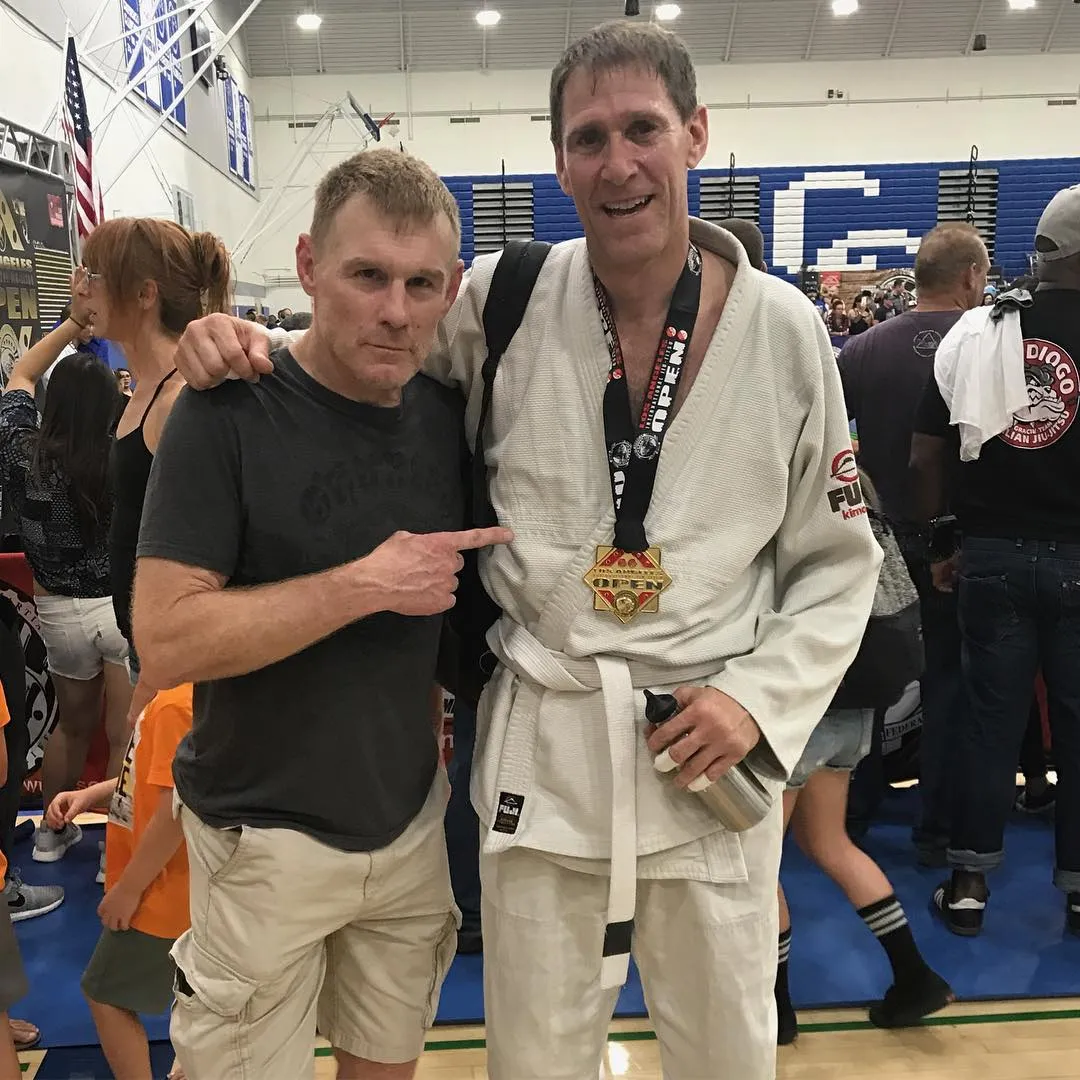 A Boran Brazilian Jiu-Jitsu student wearing his gold medal at an open tournament