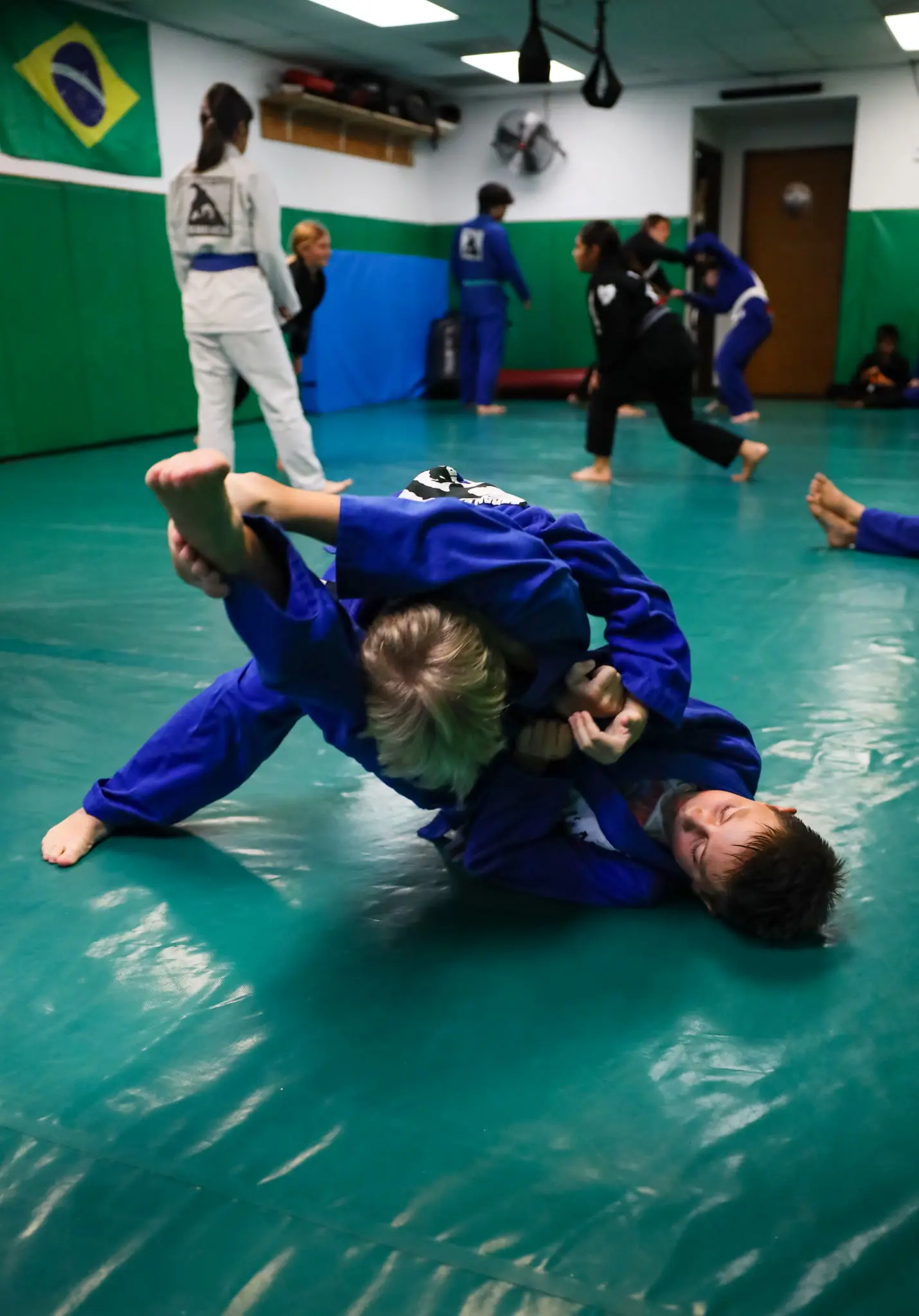 The same two students a moment later, one rolling through to come out on top